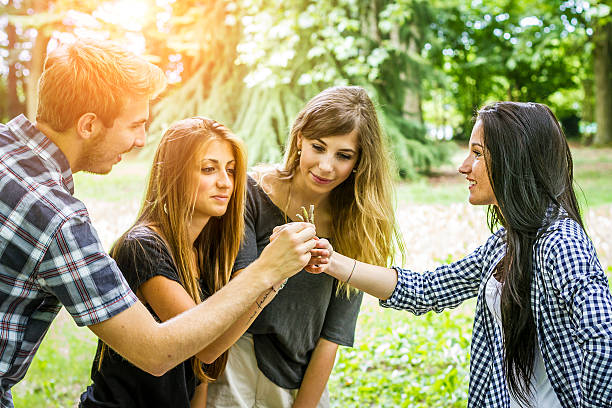 Group of friends Choosing a Stick