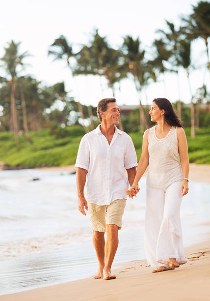 istock Mature Couple Enjoying Walk on the Beach 512801711