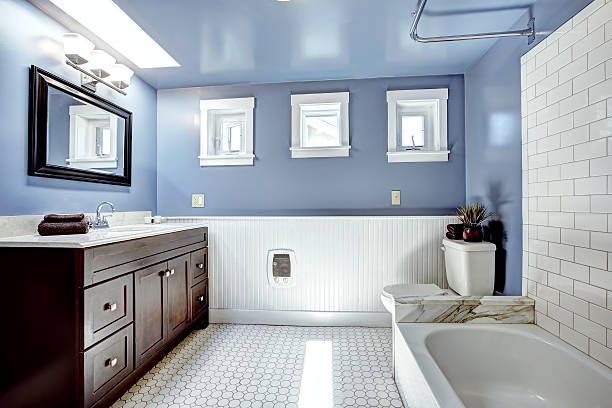 istock Beautiful lavender bathroom with white wall trim 512801759