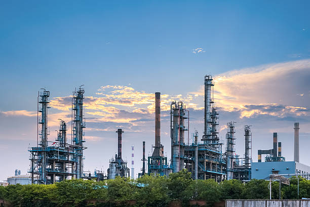 petrochemical plant at dusk petrochemical plant in sunset , industrial landscape background plant fertilizer stock pictures, royalty-free photos & images