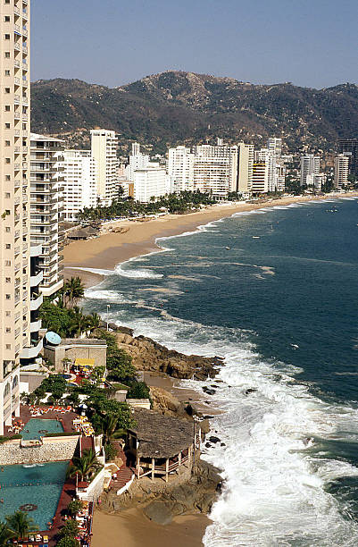 istock Beachfront Hotels and Ocean Surf Acapulco Mexico 512803021