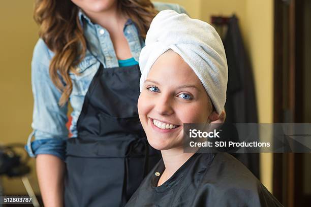 Happy Young Woman Smiling After Getting Hair Washed At Salon Stock Photo - Download Image Now