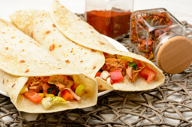istock Tortilla wrap with meat and vegetables. 512804896