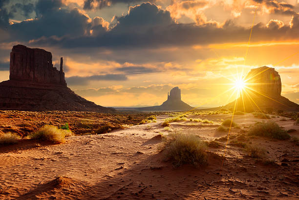 Monument Valley Sunset at the sisters in Monument Valley, USA mesa arizona stock pictures, royalty-free photos & images