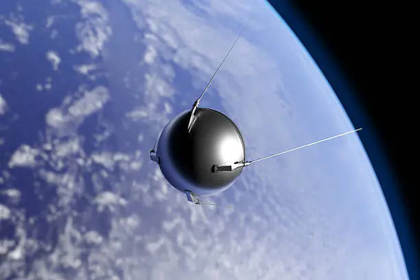 An illustration of the first artificial satellite "Sputnik", launched by the Soviet Union in 1957, orbiting the Earth