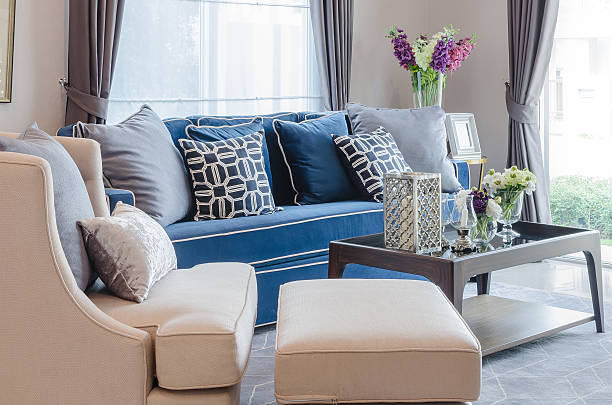istock classic blue sofa with pillows and wooden table 512806126