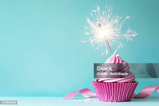 Pink Cupcake With Sparkler Stock Photo - Download Image Now - Cupcake, Celebration, Cake