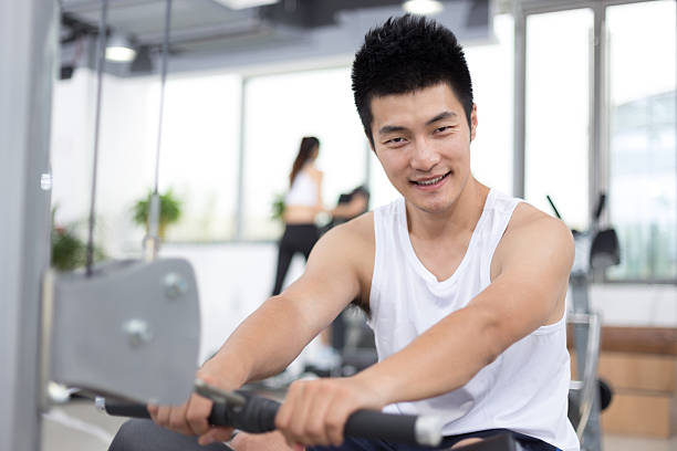 istock young handsome man working out in modern gym 512806786