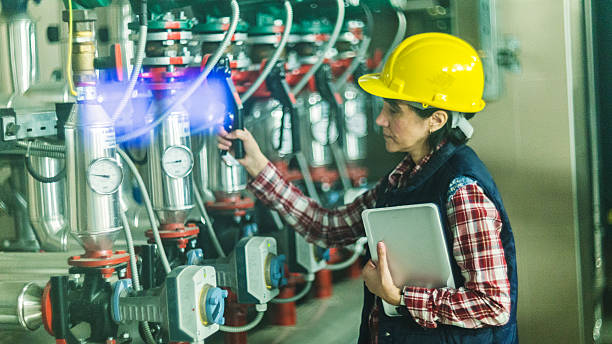 istock Technician working on valve in factory or utility 512807200