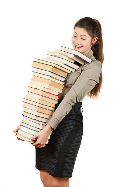 istock Girl with books isolated on white background. 512807216