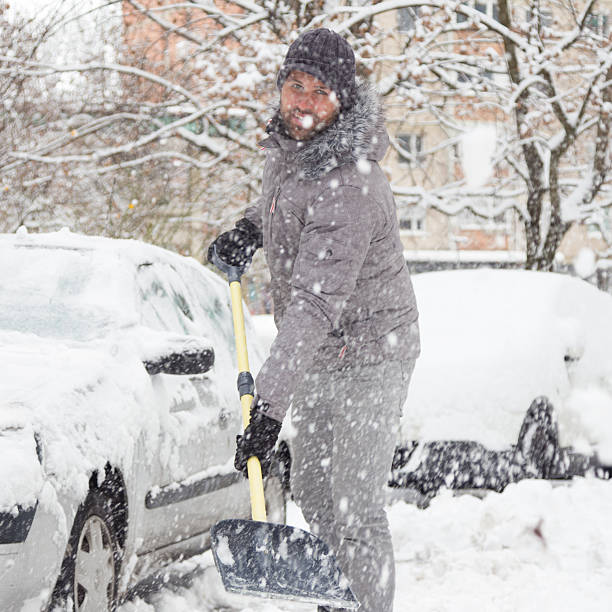 istock Man shoveling snow in winter. 512809058