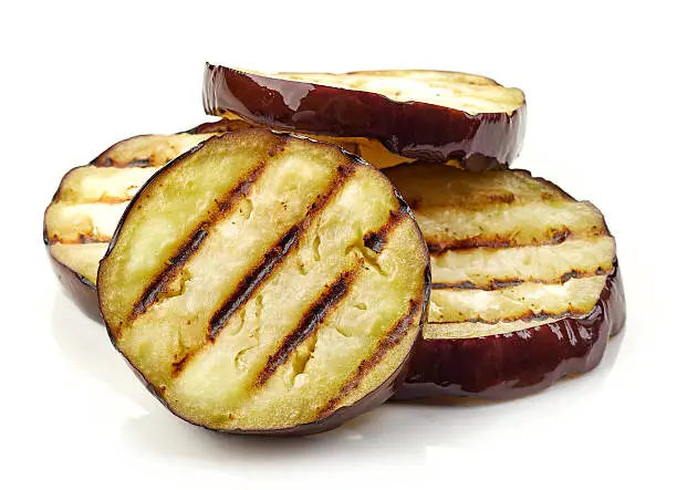 grilled eggplant slices isolated on white background