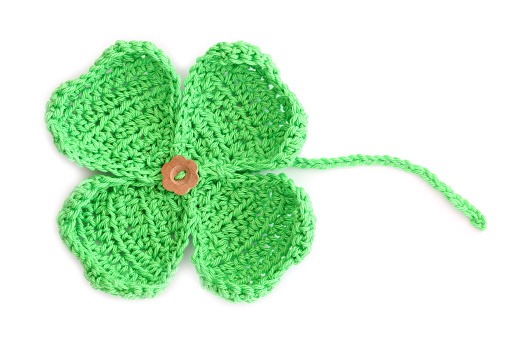 Homemade Crochet Green Four Leaf Clover Isolated On White.