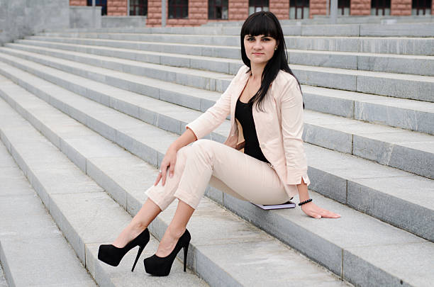 istock Long-haired brunette on high heels and urban background 512811354
