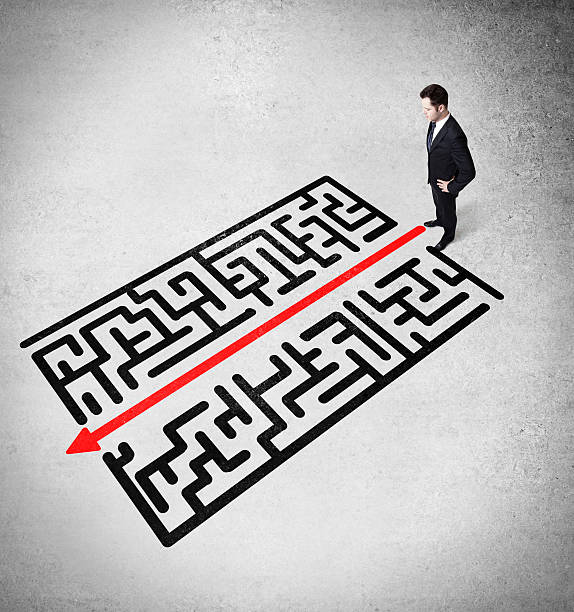 istock businessman looking on a labirinth 512813010