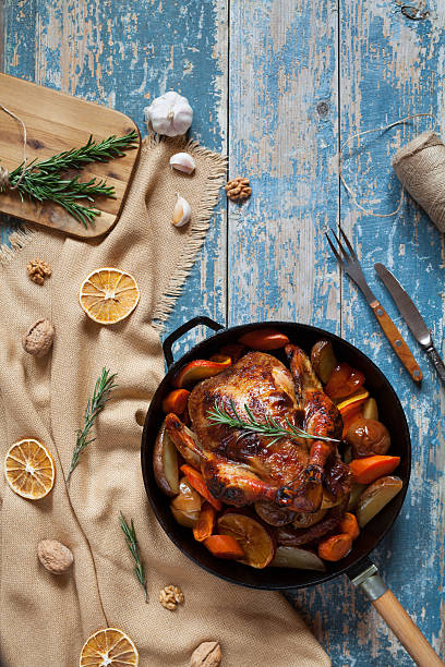 istock Barbecued whole chicken stuffed with vegetables and spices 512813734