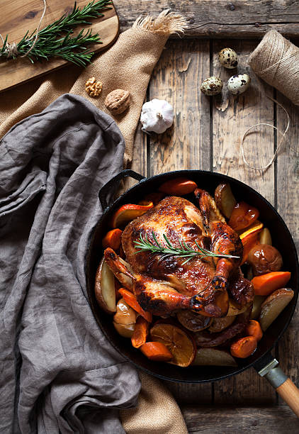 istock Roasted chicken, brown crispy skin stuffed with various vegetables 512813802