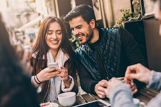 istock Two couples having fun in cafe outdoors 512816884