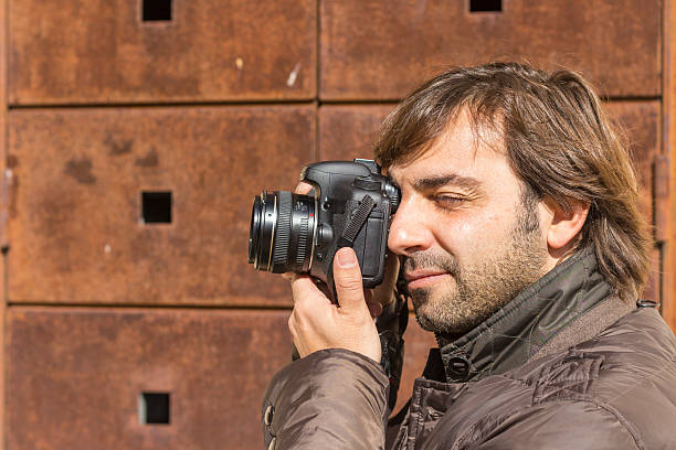 istock Close-up of handsome photographer 512816924