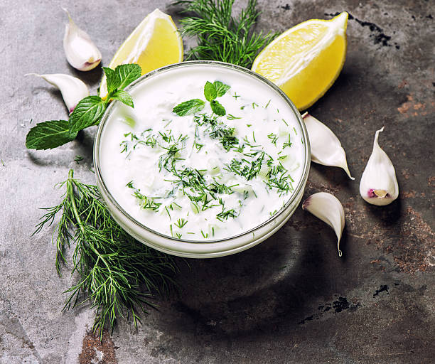 Greek tzatziki sauce. Dill, mint, garlic, lemon stock photo