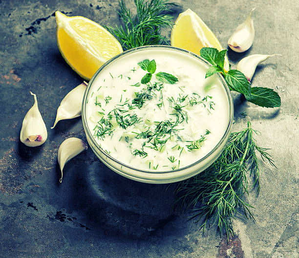 istock Tzatziki sauce. Fresh dip. Herbs dill mint vintage 512817658