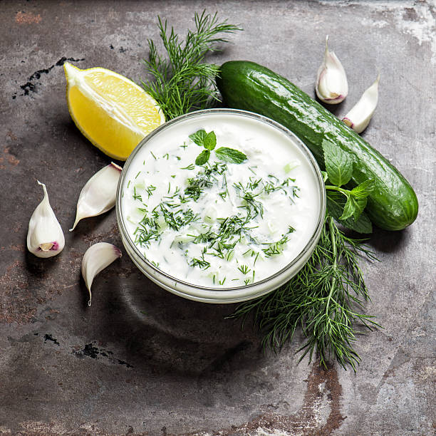 istock Fresh tzatziki yogurt sauce. Herbs and vegetables 512817670