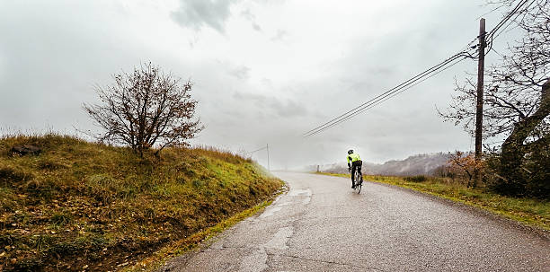 istock Man on bike training in the rain 512817730