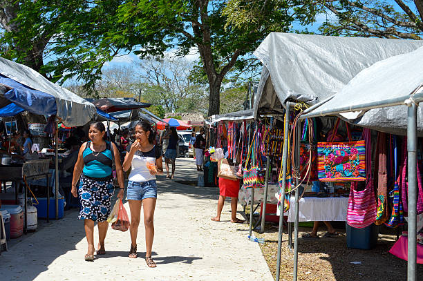 San Ignacio, Belize - March 21, 2015: People are walking through the vibrant and busy traditional Saturday market 