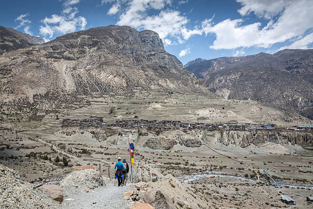 istock Two Hikers Hiking Climbing Annapurna Trek, Nepal 512821650