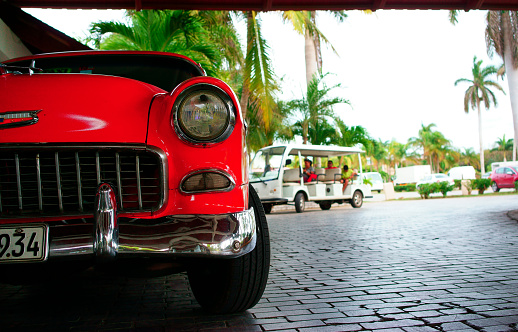 Havana, Cuba - February 9, 2016: Old American cars are iconic sight of Cuba street.