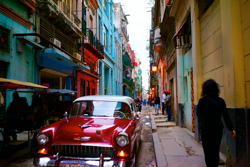 Havana, Cuba - February 10, 2016: Old American cars are iconic sight of Cuba street.