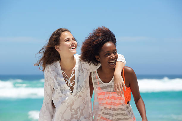 istock Carefree young women at the beach 512824368
