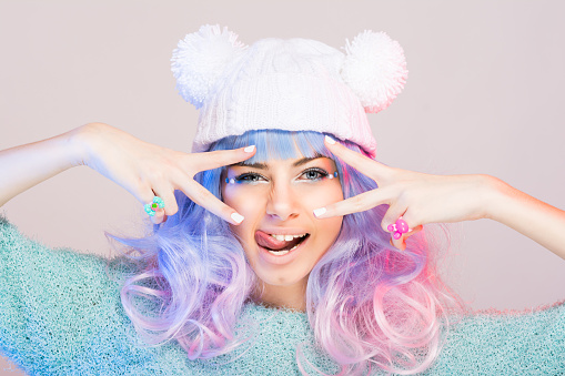 Modern young woman with pastel pink and blue hair