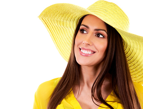 young woman wearing yellow shirt and hat on white background