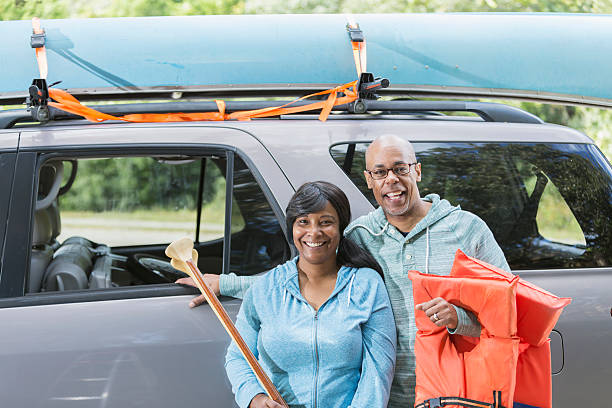 istock Mature couple preparing to go canoeing 512825276