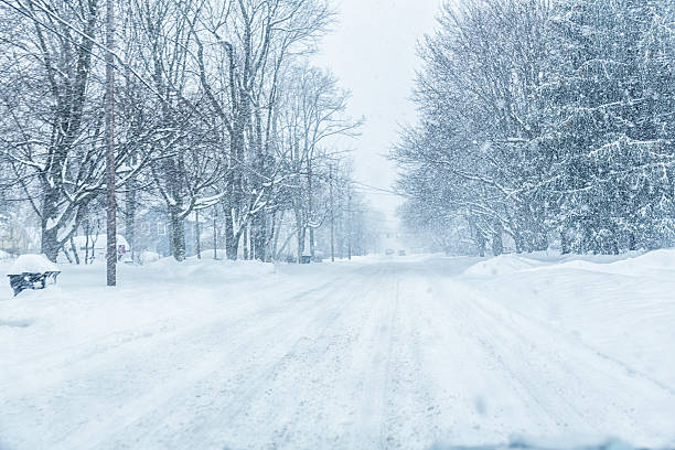 istock Suburban Road Through Car Windshield During Blizzard Snow Storm 512827000