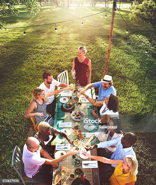 Friends Dining Outdoor Nature Garden Concept Stock Photo - Download Image Now - Picnic, Friendship, Summer