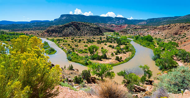 Rio Chama near Abiquiu A bend in the Rio Chama near Abiquiu, New Mexico. santa fe new mexico mountains stock pictures, royalty-free photos & images