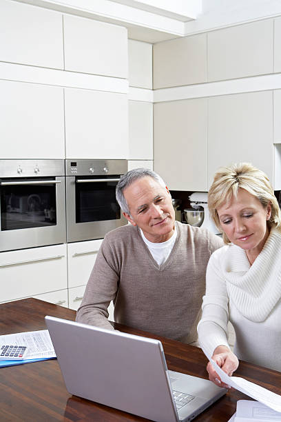 istock Couple Calculating Home Finances On Laptop 512829587