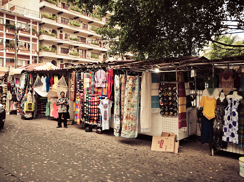 Puerto Vallarta, Mexico - January 3, 2015: Street vendor in old Puerto Vallarta selling textiles and clothes. Photo taken during the day.