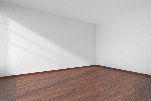 istock Empty room with dark parquet floor and textured white walls 512829864