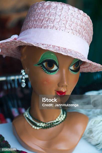 Vintage Fashion Mannequin With Pink Hat In Shop Window Stock Photo - Download Image Now