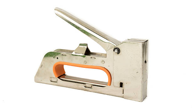 istock Stainless steel staple gun tacker isolated on white background 512831513