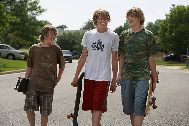istock Boys With Skateboards Walking On Street 512832589
