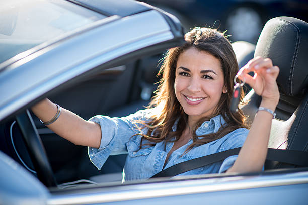 istock Woman holding car keys 512833847