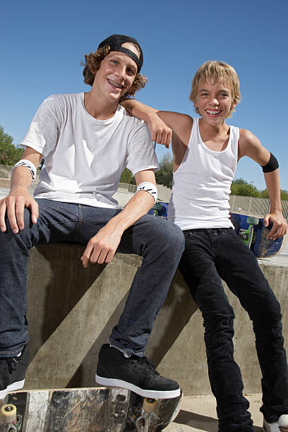 istock Happy Boys With Skateboard In Skate Park 512834949