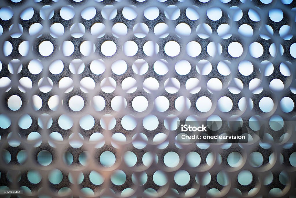 Metal Fence with Round Hole Pattern Metal fence patterned with round holes. Abstract Stock Photo