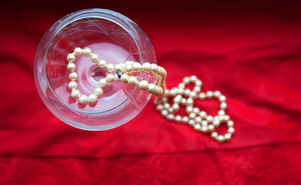 pearls in wine glass stock photo