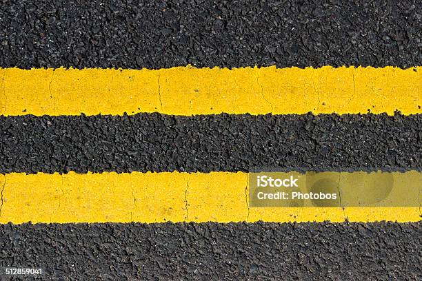 Urban Texture Double Yellow Lines On Street Stock Photo - Download Image Now - City, Street, Yellow Line - Road Marking