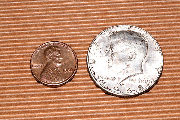 istock John F Kennedy Half Dollar and penny 512860181